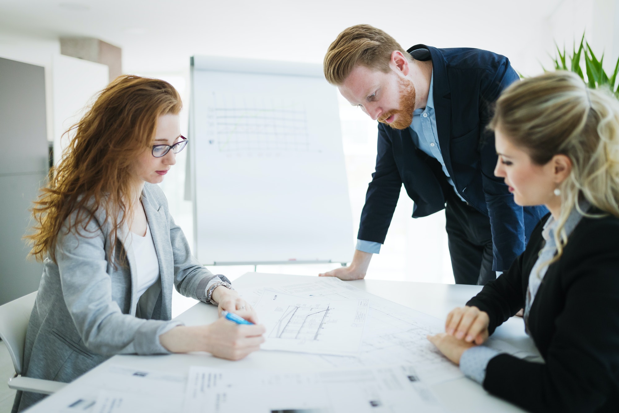 Collaboration and analysis by business people working in office